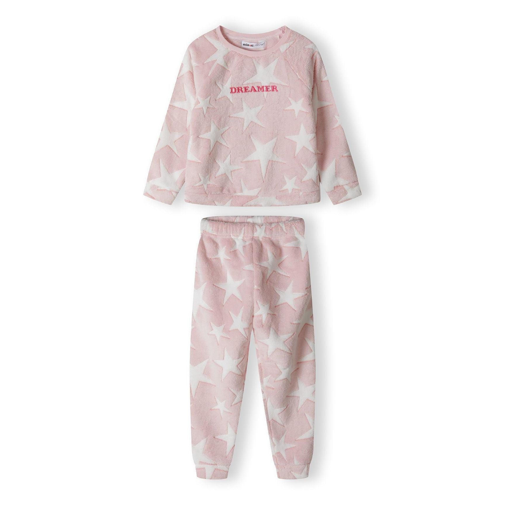 Back view of pink fleece pyjama top with white star pattern and raglan sleeves laid flat on white background