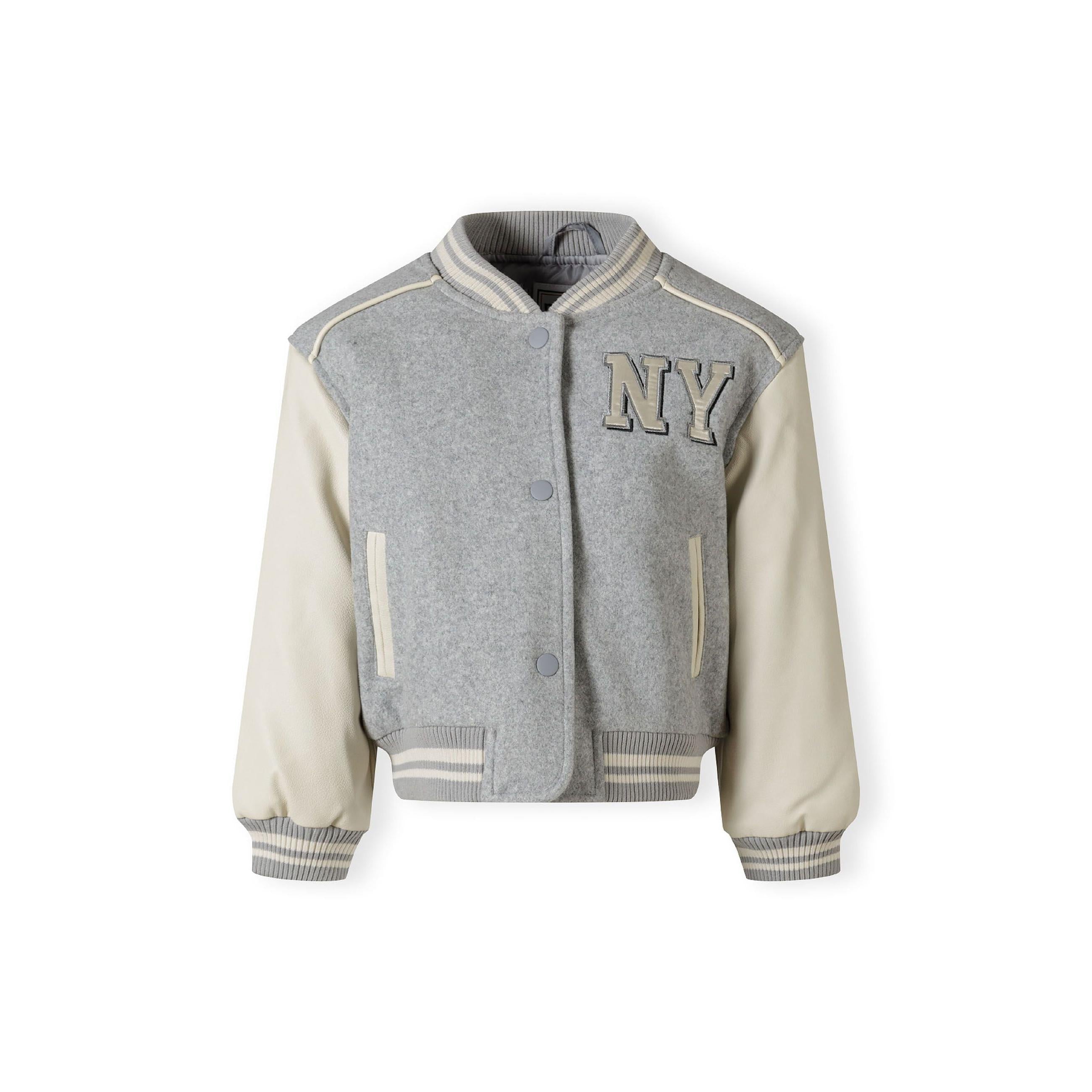 Back view of grey baseball jacket showing ribbed collar and contrasting cream faux leather sleeves against white background