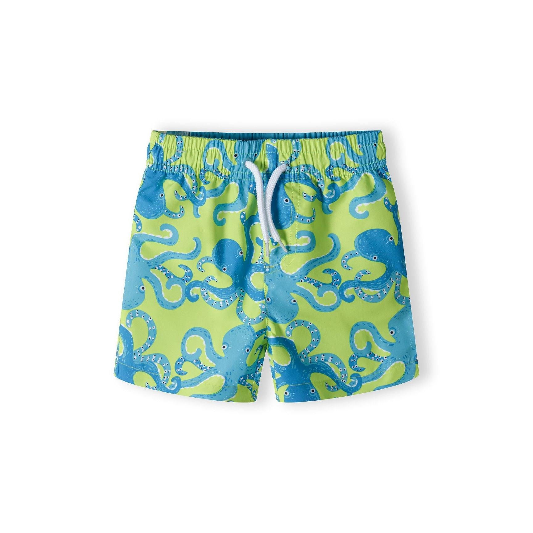 Front view of lime green board shorts with blue octopus print pattern, featuring elasticated waistband with white drawstring tie, displayed flat against white background