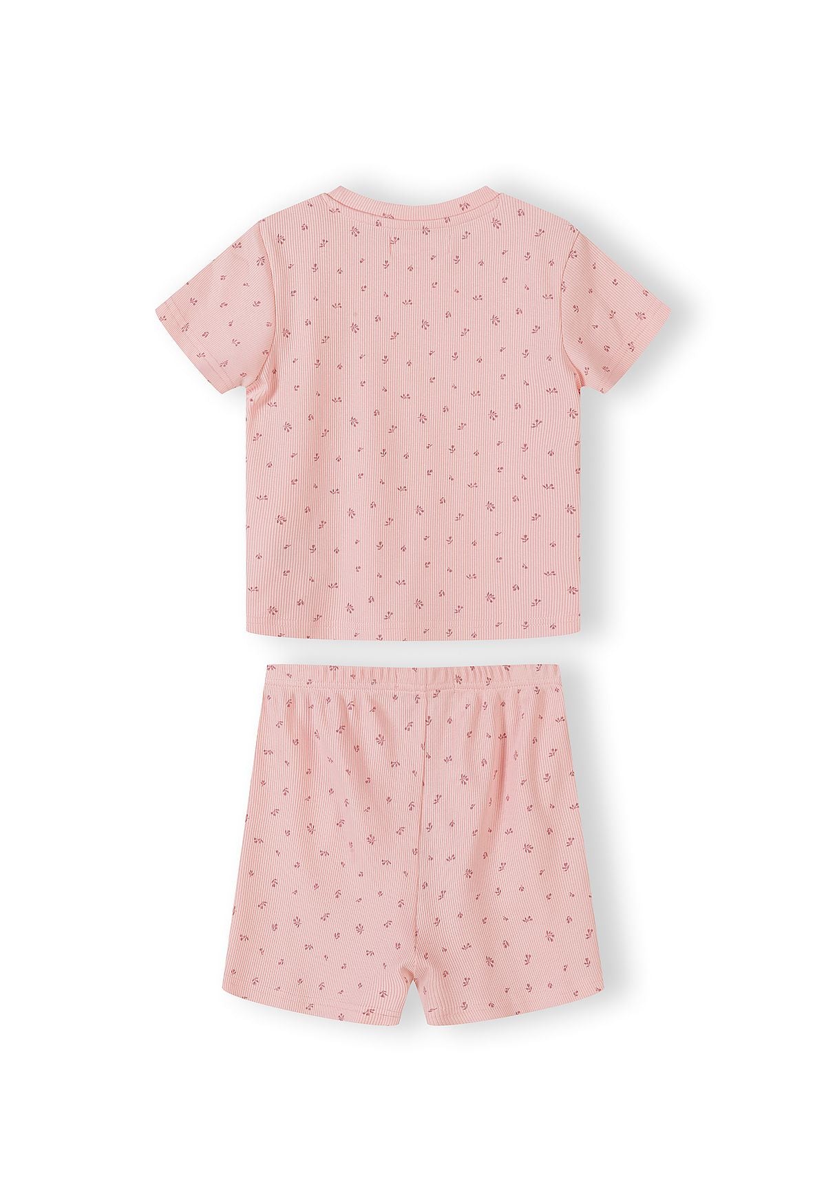 Close-up of pink ribbed pyjama set with small floral print pattern showing top and matching shorts