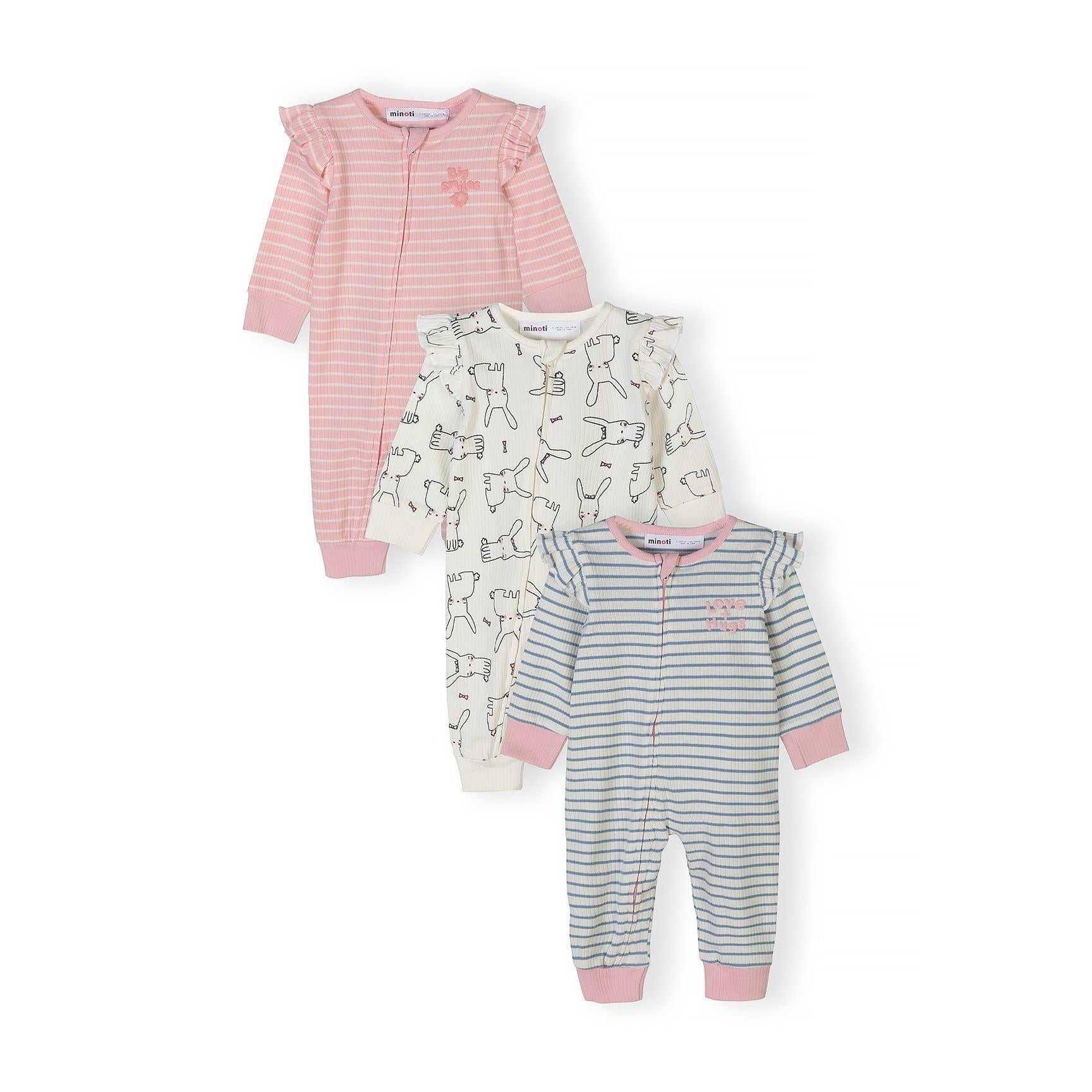Three baby sleepsuits laid flat showing pink striped, cream bunny print, and grey striped designs with full-length zips
