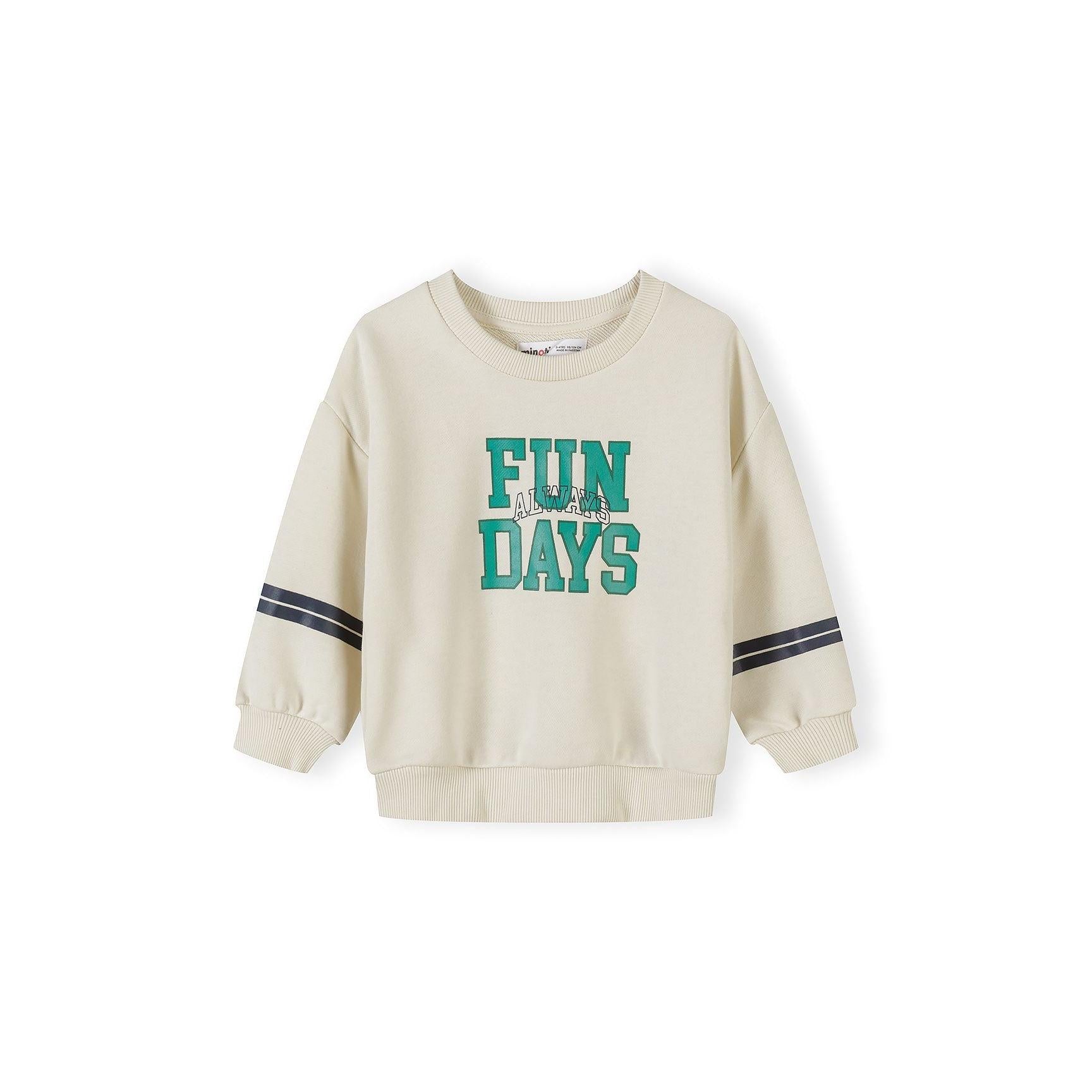 Close-up of green sweatshirt showing NYC Training Gym graphic with Let's Work Out Best Gym in NYC text on ribbed cotton blend fabric