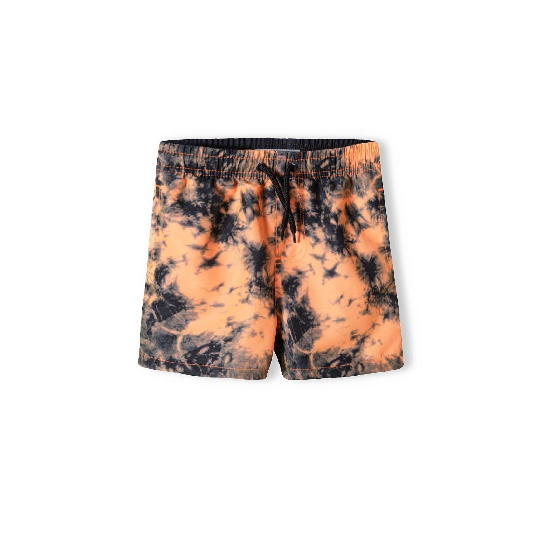 Orange tie-dye board shorts laid flat showing full front view with elastic waistband and vibrant pattern against white background