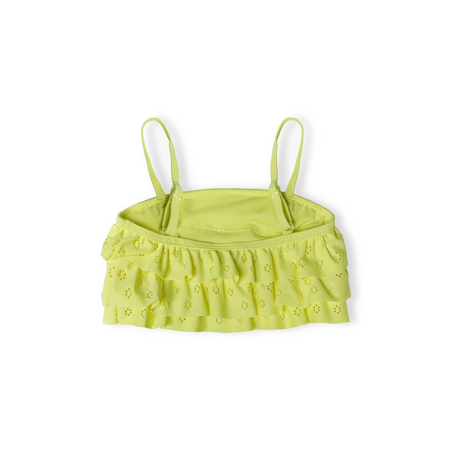 Close-up view of yellow broderie anglaise bikini top showing detailed ruffled trim and adjustable shoulder straps on white background