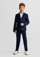 Young boy wearing slim fit navy blue formal trousers with a matching blazer, showcasing a smart design for kids fashion