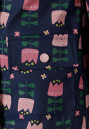 Girls rain jacket printed navy 1-6y, featuring a navy base with floral pattern and pocket details. Waterproof fabric ensures dryness.