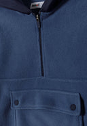 Close-up of a blue boys microfleece half zip hoodie featuring a half zip front and a flap pocket.