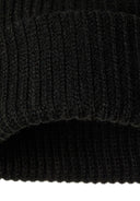 Detail of a ribbed-knit black hat with a snug fit.