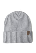 Close-up of a gray ribbed knit hat with a tab detail on the cuff.