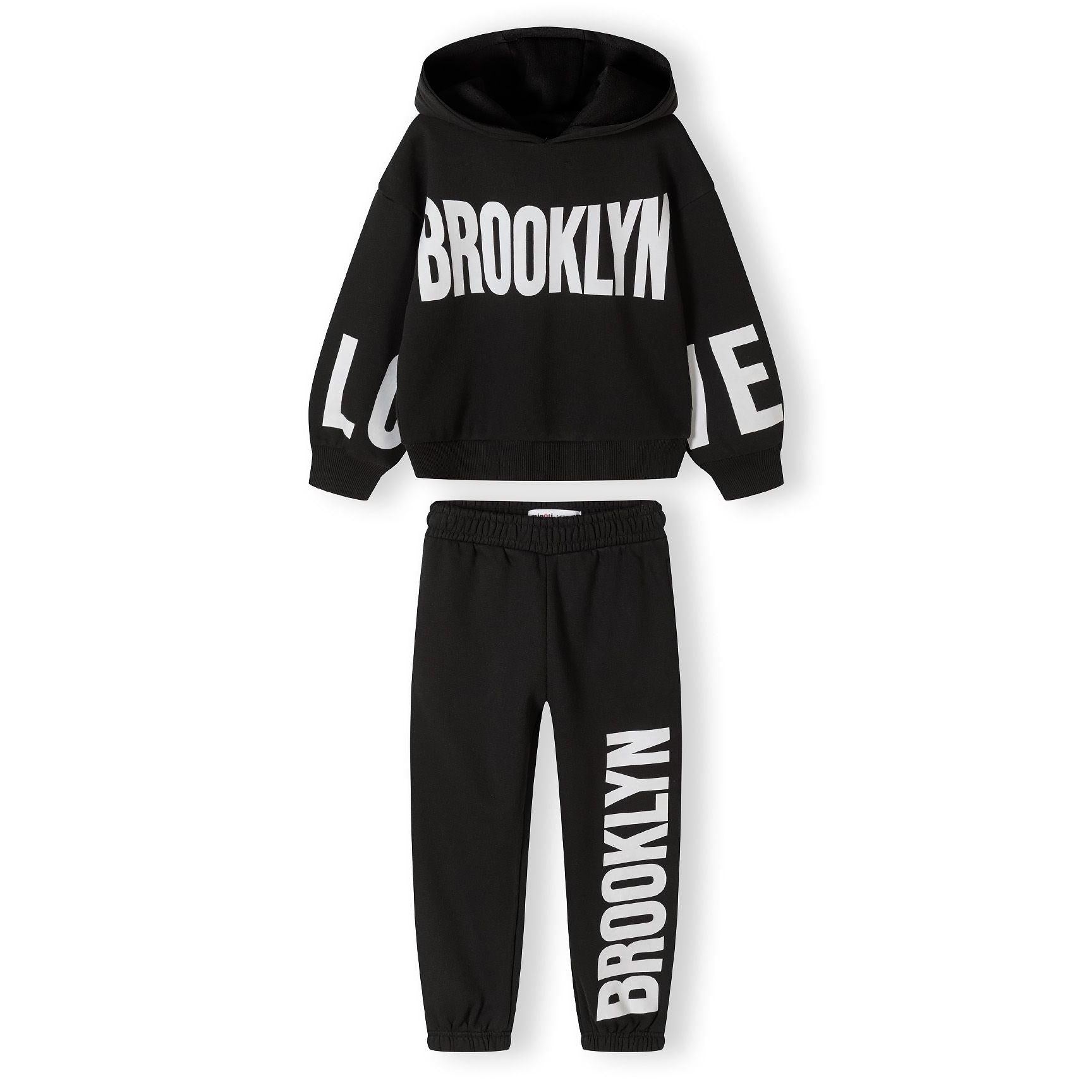 Back view of black hooded sweatshirt showing hood detail and relaxed fit on white background