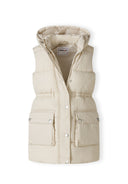 Girls padded gilet in cream, front view with snap fastening and zip closure, featuring two front pockets.