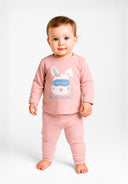 Girls long sleeve pyjamas set in pink with polka dots, featuring a bunny graphic and ribbed cuffs.
