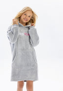 Oversized grey girls hoodie with hood and kangaroo pocket, front view.
