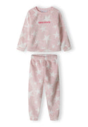 Girls pyjama set in pink with star pattern, featuring raglan sleeves and relaxed fit.