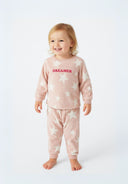 Girls pyjama set in pink with star pattern, featuring raglan sleeves and a relaxed fit.