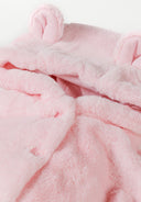 Detail of a light pink baby jacket with hood and ears, featuring a button closure.