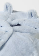 Detail of light blue baby unisex faux fur jacket with 3D ears and hood.