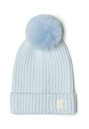 Unisex rib beanie in light blue with pom pom, front view, featuring a subtle badge.