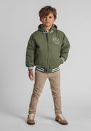 Boys baseball jacket in khaki with detachable hood, ribbed cuffs, and embroidered detail, front view.