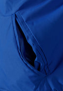 Detail of cobalt blue boys baseball jacket pocket with zipper.