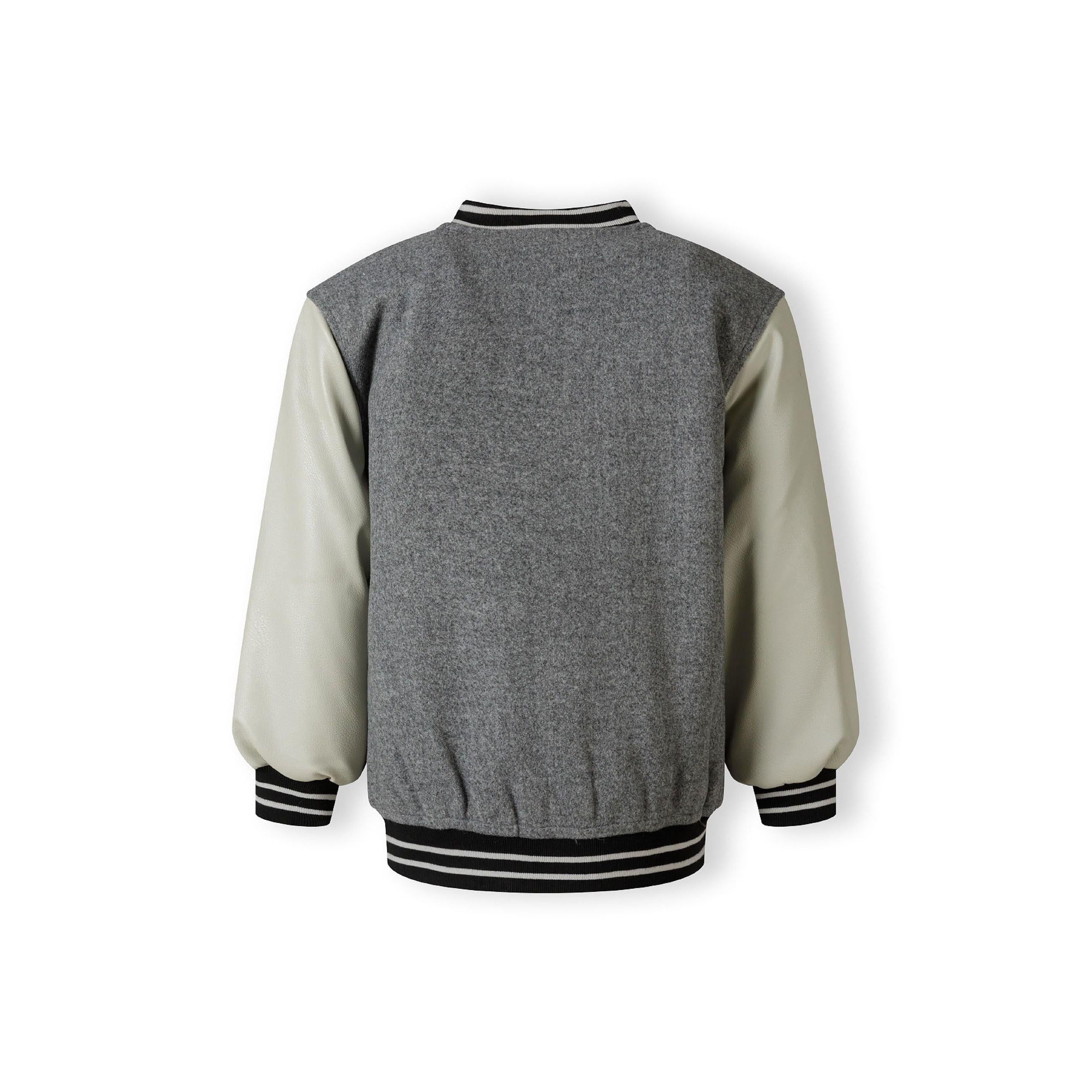 Back view of grey varsity jacket with cream PU sleeves and ribbed trim details on white background