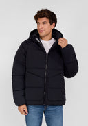 Boys black quilted jacket, front view, features hood and zip pockets.