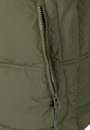 Detail of a khaki boys quilted jacket featuring a zippered pocket.