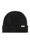 Black ribbed beanie hat with fold-up cuff, detail view.