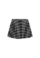 Girls checked pleated skirt black 3-14y with black and white checked pattern, designed for comfort and active movement.