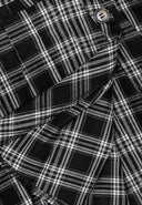 Girls checked pleated skirt black 3-14y with a black and white checked pattern and button fastenings. Designed for active movement.