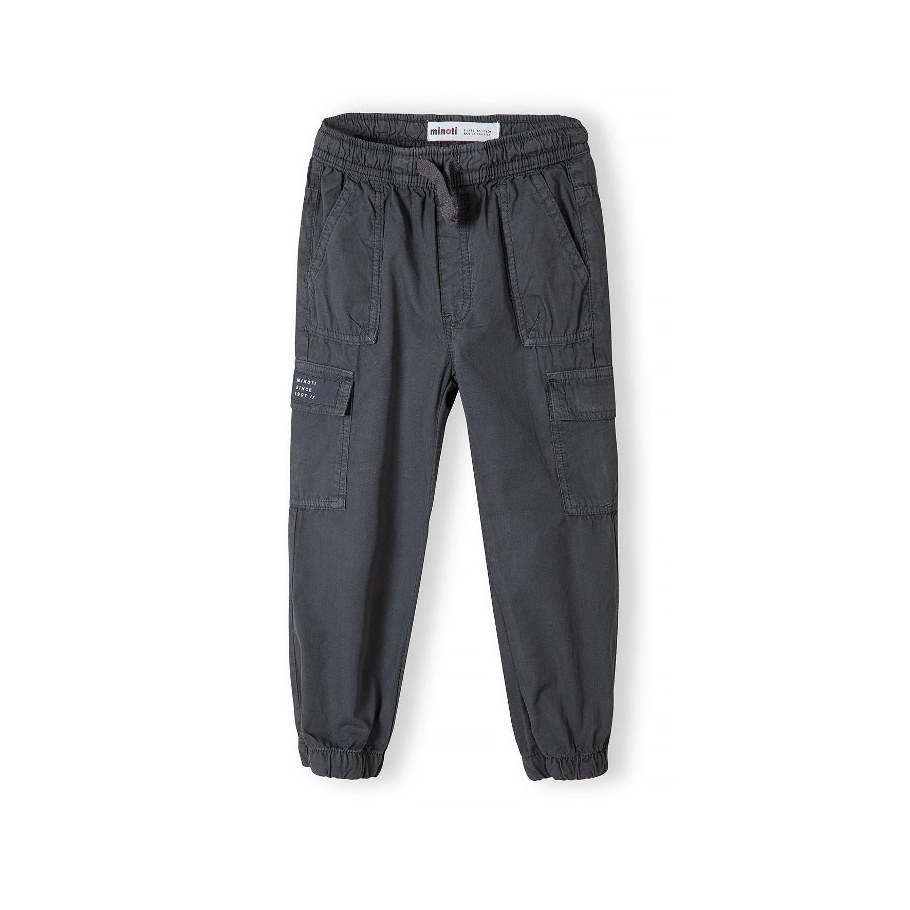 Back view of black combat trousers laid flat showing elasticated waistband, cargo pockets on sides and elasticated cuffed hem design