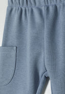 Soft blue jogger trousers with elasticated waistband and side pocket for boys 3-24m. Perfect for casual wear.