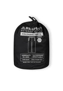Detail of black packaway waterproof overpants in a storage pouch.