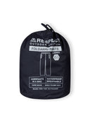 Women packaway waterproof overpants navy 36-48 in a compact drawstring bag, featuring waterproof and breathable design for outdoor activities.