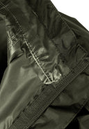 Close-up of kids packaway waterproof jacket hood khaki 3-14y fabric showing waterproof lining and secure stitching details.