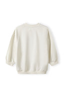 Back view of a cream girls fleece crew sweatshirt with ribbed cuffs and hem.