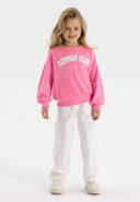 Girls pink fleece crew neck sweatshirt with print, front view.