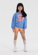 Girls blue fleece crew neck sweatshirt with floral print, front view.