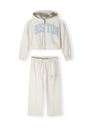 Cropped zip-through hoodie and wide leg joggers set in cream with printed designs and kangaroo pocket.