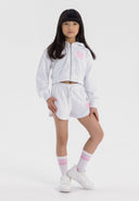 Girls zip-through hoodie and shorts set, white, front view, features printed design and side pockets.