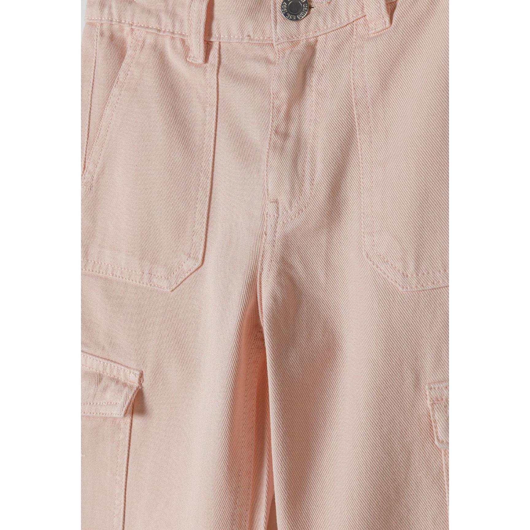 Close-up detail of pink cargo trousers showing front waistband with button closure and cargo pocket construction