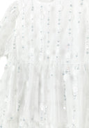 Detail of a girls' white short sleeve dress with sequin flower embellishments.