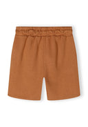 Detail of beige shorts with elasticated waistband and side pockets.