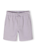 Detail of lilac shorts with elasticated waistband and side pockets.