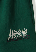 Detail of green fleece fabric with 'Awesome Unlimited' print.
