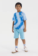 Boys short sleeve t-shirt with blue tie-dye and fleece shorts, front view.