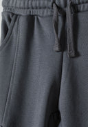Close-up of boys' grey cargo joggers with side pockets and drawstring waistband.