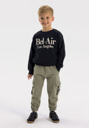 Boys khaki cargo joggers with elasticated waistband and side pockets, front view.