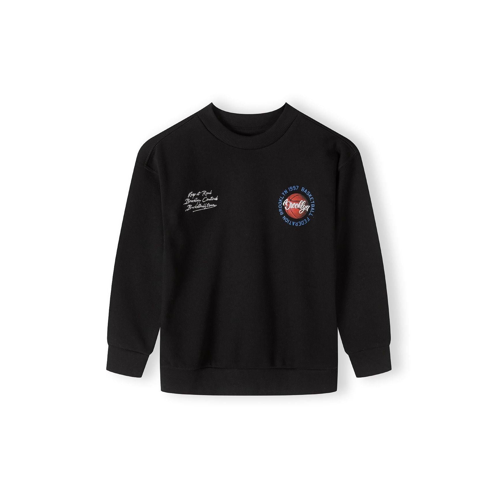 Black sweatshirt back view showing large basketball graphic print with hand spinning ball on blue sky background