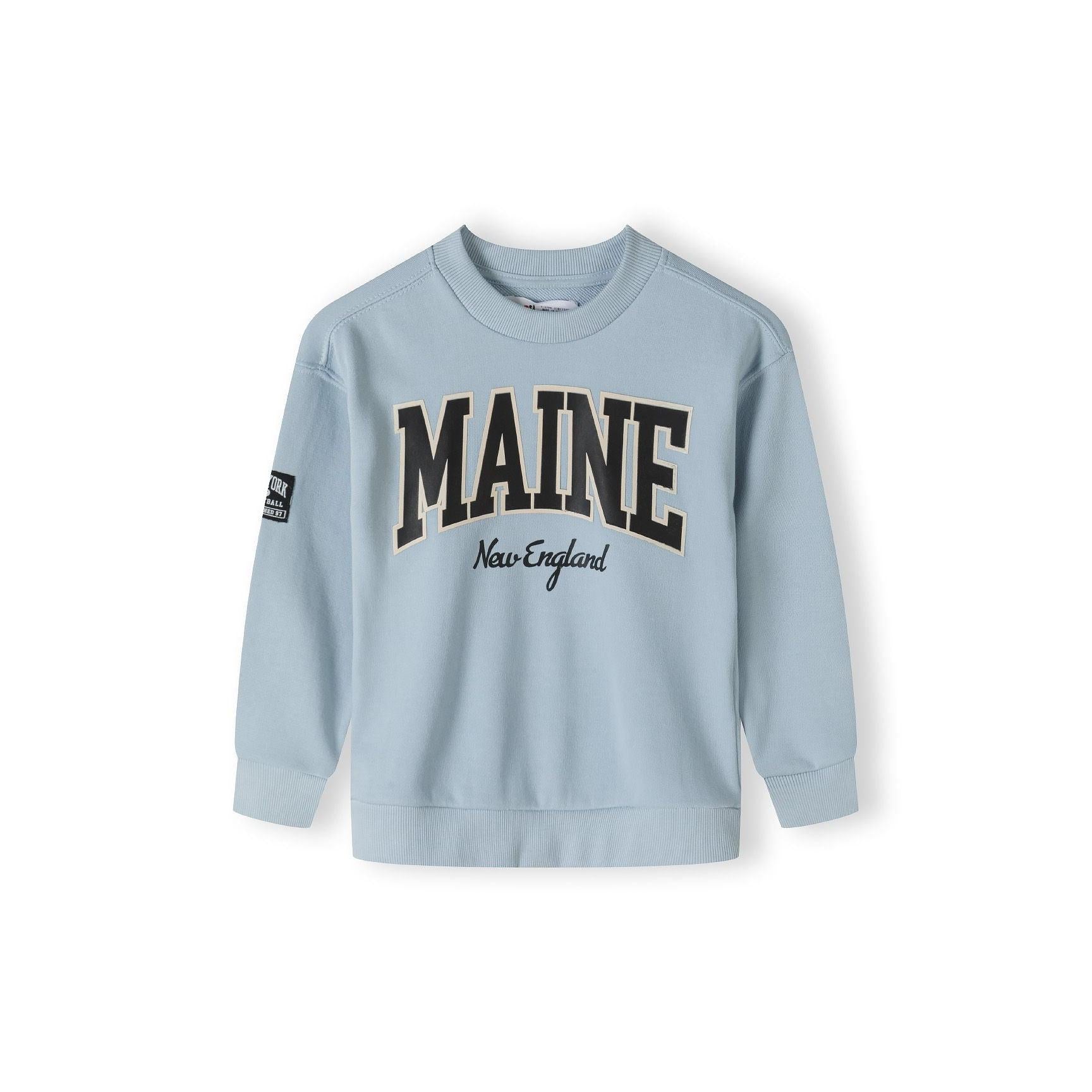 Back view of light blue fleece sweatshirt showing plain design and ribbed hem detail on white background